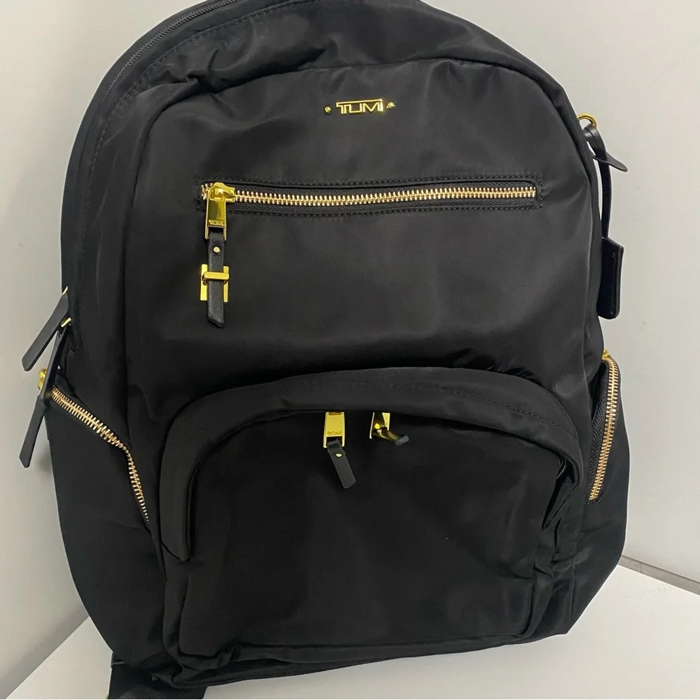 Tumi Black Backpack with Gold Zippers